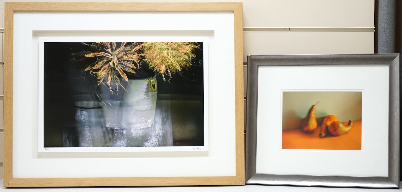 Valda Bailey (contemporary), Still life’s of fruit and flowers, one titled ‘Rainbow’, the other signed and numbered in ink, two photographic prints, largest 32 x 47cm